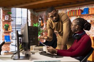 Software development agency IT coworkers doing brainstorming, coding